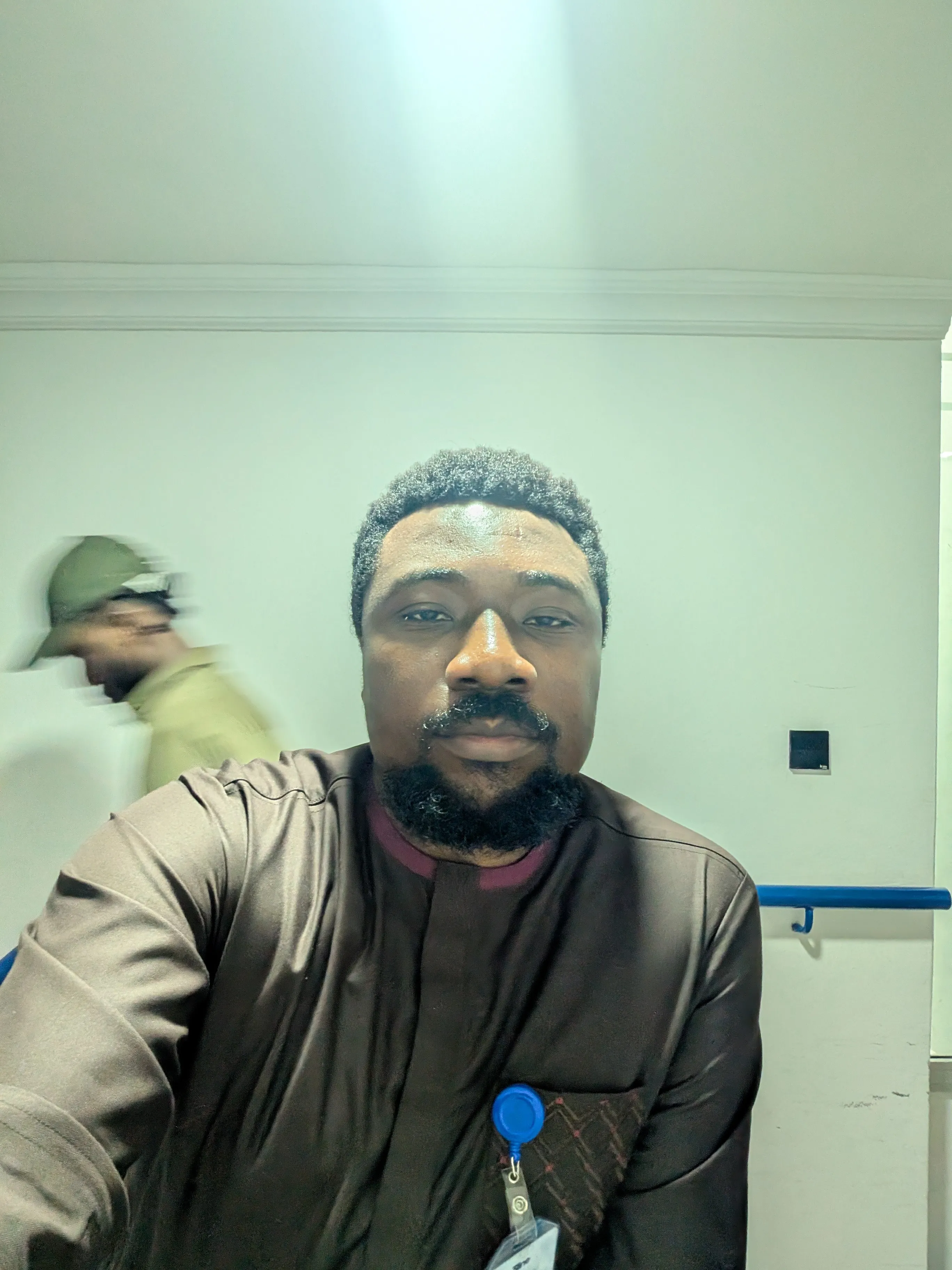 Isaac Olanrewaju in a work setting